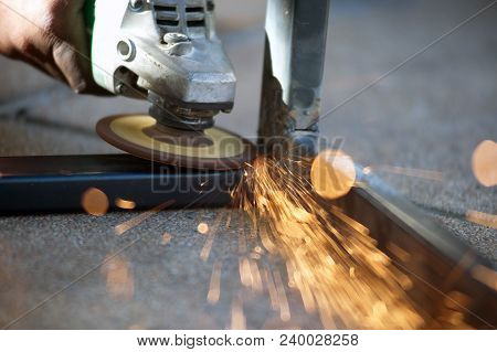 The Worker Is Welding Metal Part Of Table Steel In Factory.