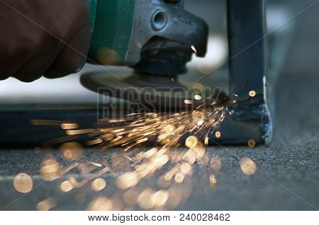 The Worker Is Welding Metal Part Of Table Steel In Factory.