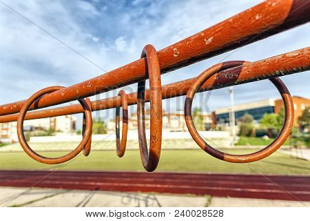 Sports Metal Rings On Uneven Bars Under The Open Sky