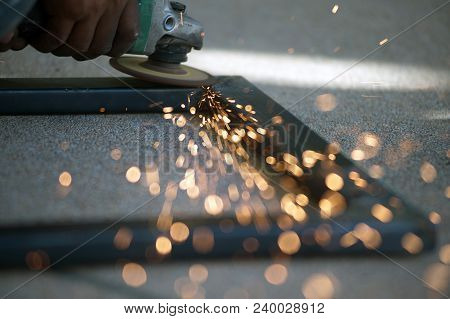 The Worker Is Welding Metal Part Of Table Steel In Factory.