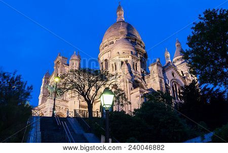 The Basilica Sacre Coeur Is A Roman Catholic Church Located At The Summet Of The Butte Montmartre , 