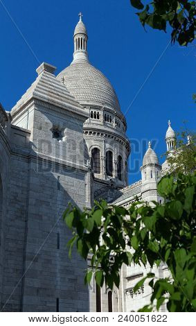 The Basilica Sacre Coeur Is A Roman Catholic Church Located At The Summet Of The Butte Montmartre , 