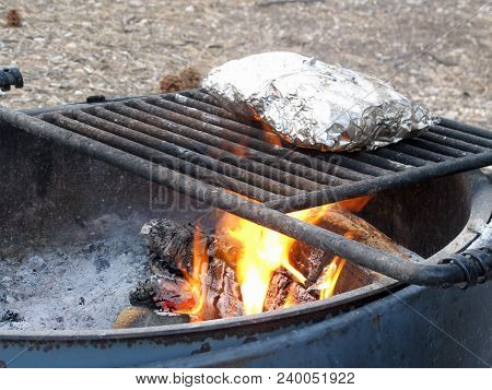 Camp Fire Cooking Foil Dinners On Grate