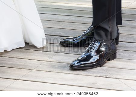 Wedding Bride And Groom Standing Next Each Other At Marriage. The Man And The Woman Wearing Luxury L