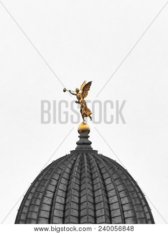 Golden Sculpture Fama Or Pheme On The Dome Of The Saxon Art Collection In Dresden As A Cutout With C