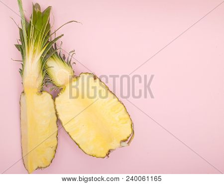 Half Cut Juicy Pineapple On A Pastel Pink Background. Minimal Summer Concept.