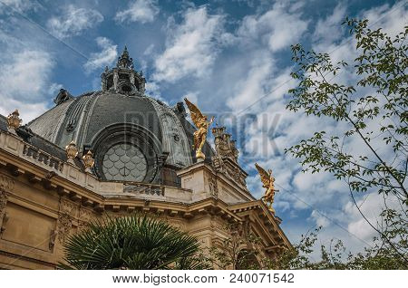 Paris, France - July 11, 2017. Far-fetched Decoration Of Dome And Golden Statues On Petit Palais Bui