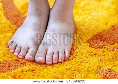 Little Girl Showing Her Dirty Feet In The Bathroom