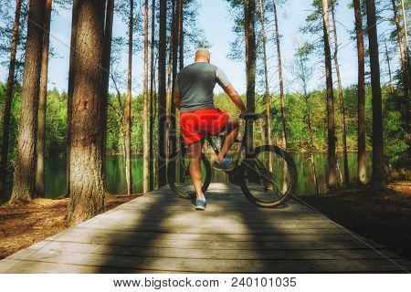 Ciclist In The Beautiful Place For Riding Around The Magic Forest Lake