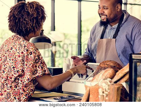 Customer ordering pasrty at counter