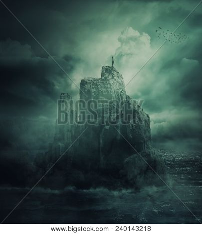 Surreal View As A Lonely Girl Stand On The Top Of A Cliff Surrounded By The Sea Water Watch A Flock 
