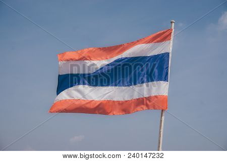 Picture Of Waving Thai Flag Of Thailand With Blue Sky Background., King Bhumipol