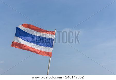 Picture Of Waving Thai Flag Of Thailand With Blue Sky Background., King Bhumipol