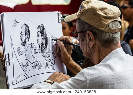 Paris, France - July 06, 2017: The Painter Works At The Open Air Artist Market At The Tertre Square 
