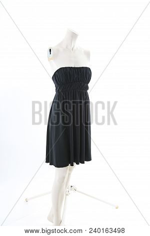 Black Mini Dress On Headless Mannequin Cloth Display Dressmaker Doll Figurine. Fashion Designer Clot