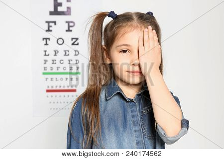 Cute Little Girl Visiting Ophthalmologist. Health Care