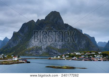 Mount Olstind And Reine Fishing Village On Lofoten Islands In Norway.
