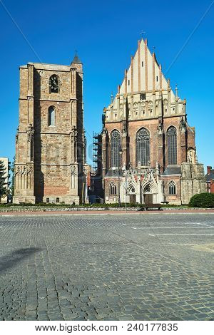 Medieval Campanile And Facade Of A Gothic Church In The City Of Nysa In Poland