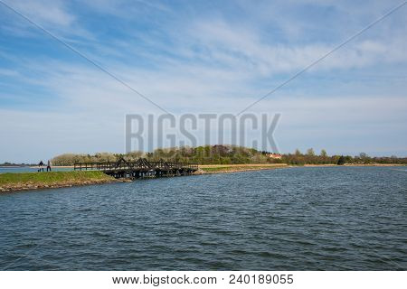 Dam And Bridge Towards Island Of Langoe In Denmark