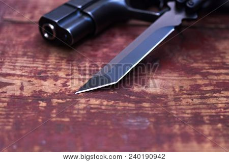 Sharper Knife. The Muzzle Of The Gun. The Photo Is Close.