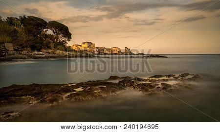 Erbalunga Village And Harbour Panorama With Rocks On Foreground, Corsica, France