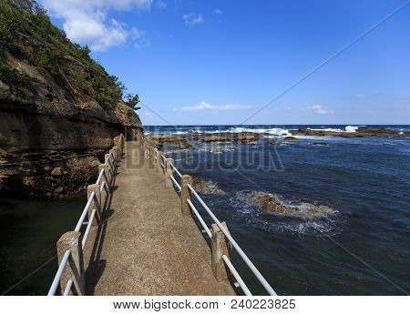 Concrete Bridge Leading Into The Sea Of Japan