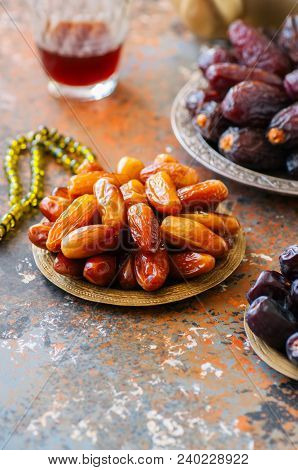 Set Of Various Of Dried Dates Or Kurma In A Vintage Plates.
