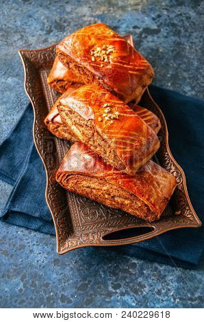 Traditional Turkish Pastry Roll With Chocolate And Nuts Filling - Pastich Served On A Vintage Tray.