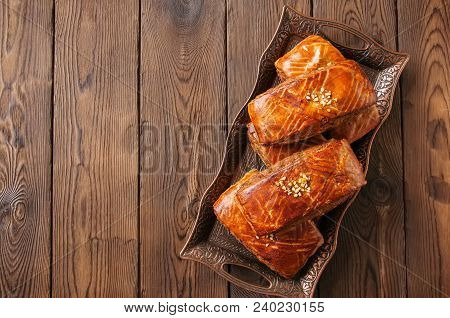 Traditional Turkish Pastry Roll With Chocolate And Nuts Filling - Pastich Served On A Vintage Tray.
