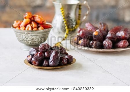 Set Of Various Of Dried Dates Or Kurma In A Vintage Plates.