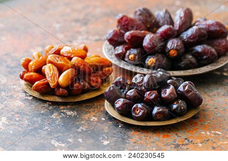 Set Of Various Of Dried Dates Or Kurma In A Vintage Plates.