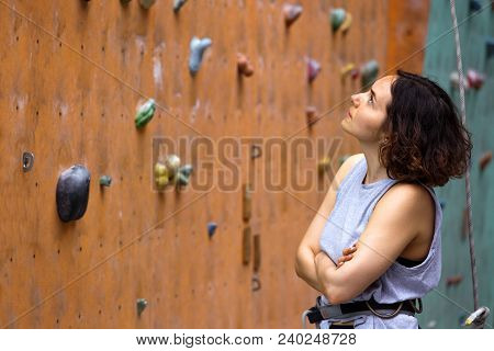 Girl Climbing Up The Wall