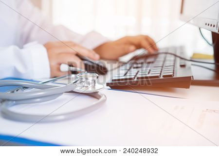 Healthcare And Medical Concept, Doctor Working Seaching Information Patient Database Through Interne