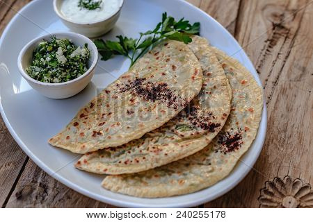 Azerbaijani Traditional Cuisine. Horizontal Shot Of Qutabs -flatbread With Greens. Served With Yogur