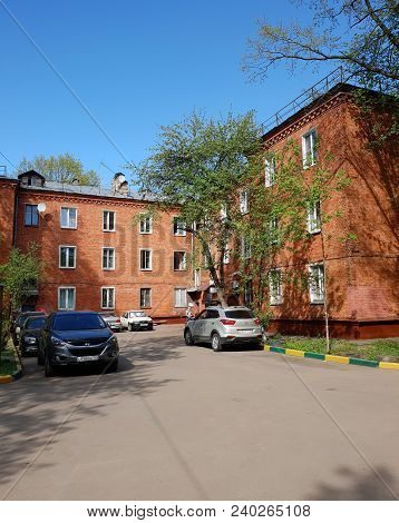Skhodnya, Russia - May 07. 2018. Residential Buildings Of Red Brick In An Old Buildings