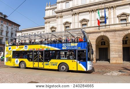 Milan, Italy - April 07, 2018: Open Tour Double Decker Bus Near La Scala Theatre In Milan.