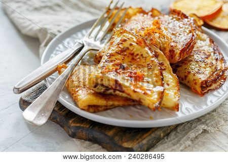 Crepe Suzette With Orange Sauce For A Delicious Breakfast, Selective Focus.