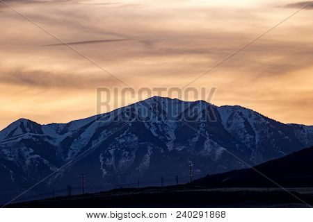 Snowy Ridgeline In The Rocky Mountains At Sunset Or Sunrise