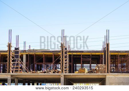 Lots Of Tower Construction Site With Cranes And Building With Blue Sky Background