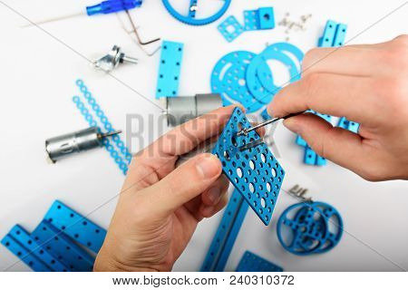 Put Screw In Rc Model. Man Making Rc Kit Close-up