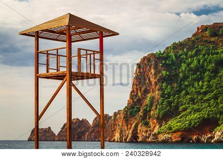 Empty Lifeguard Station At The Beach With A Beautiful View Oh The Lawny Mountain And A Sea