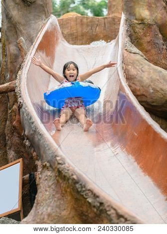 Happy Girl Play Water Slider, Receation And Leisure Concept