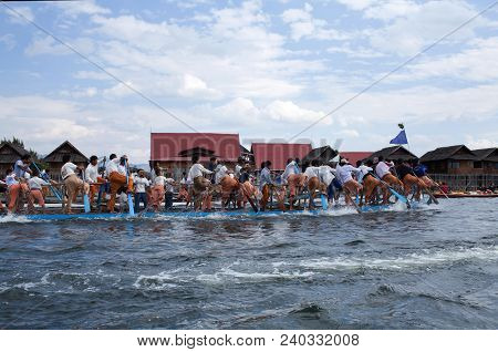 Nyaung Shwe, Myanmar - January 17, 2011: Team Of Burmese Leg Rowers Crossing The Lake During Annual 