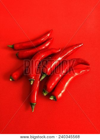 Cofred Hot Pepper On Red Plain Background
