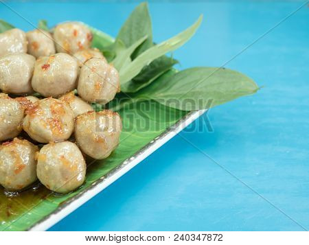 Griiled Pork Meatball With Spicy Sauce And Basil Leaf On The Table, Thai Appetizer