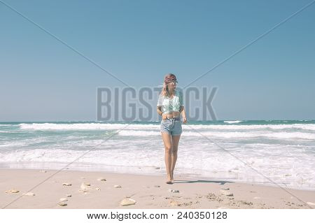 Young Woman Resting On The Sand Beach And Taking Photo With Mobail Phone