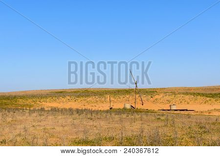 Old Sweep Well And Shadoof In Steppe.