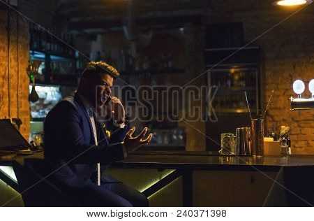 Angry Businessman Calling On The Phone From The Bar, Shouting, Having Troubles. Leasure, Hard Day, R