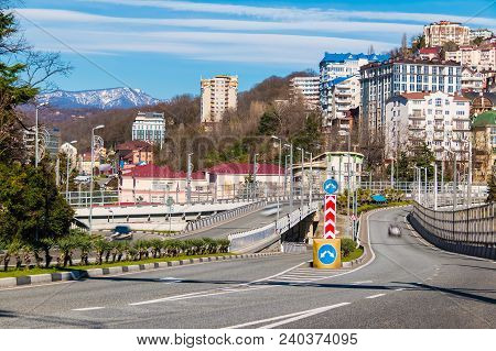 Cityscape With Kurortny Prospekt O The Background Of Mountains And Apartment Buildings In Sunny Day,