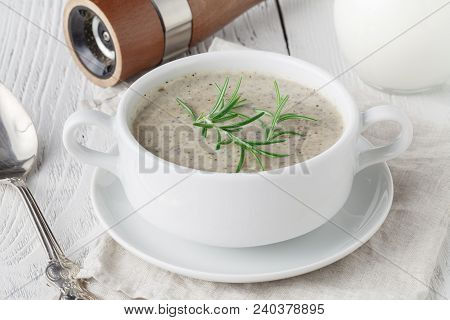 Creamy Mushroom Soup On White Wooden Table